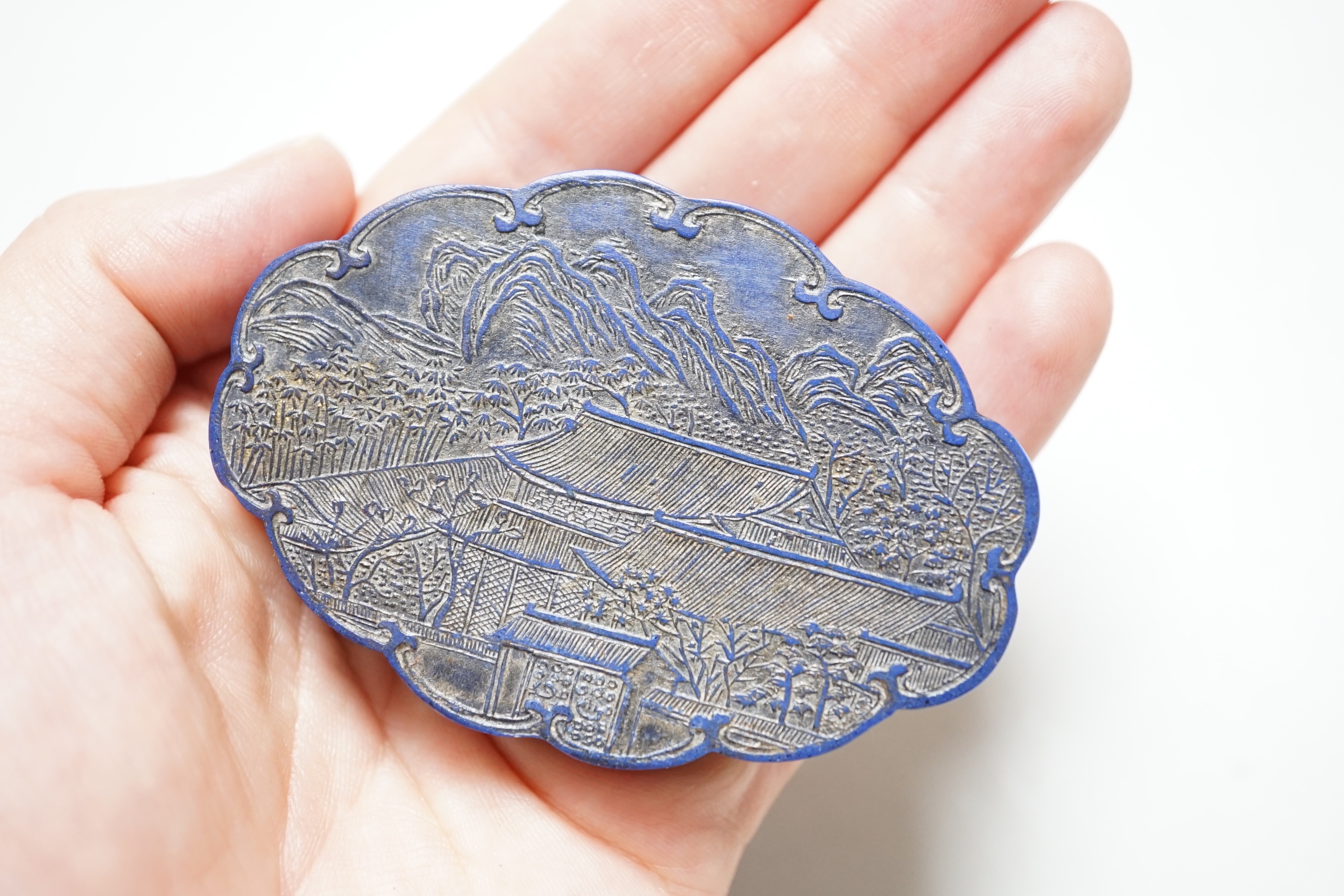 A Chinese ink block in a fitted wood box, 9.5 cm